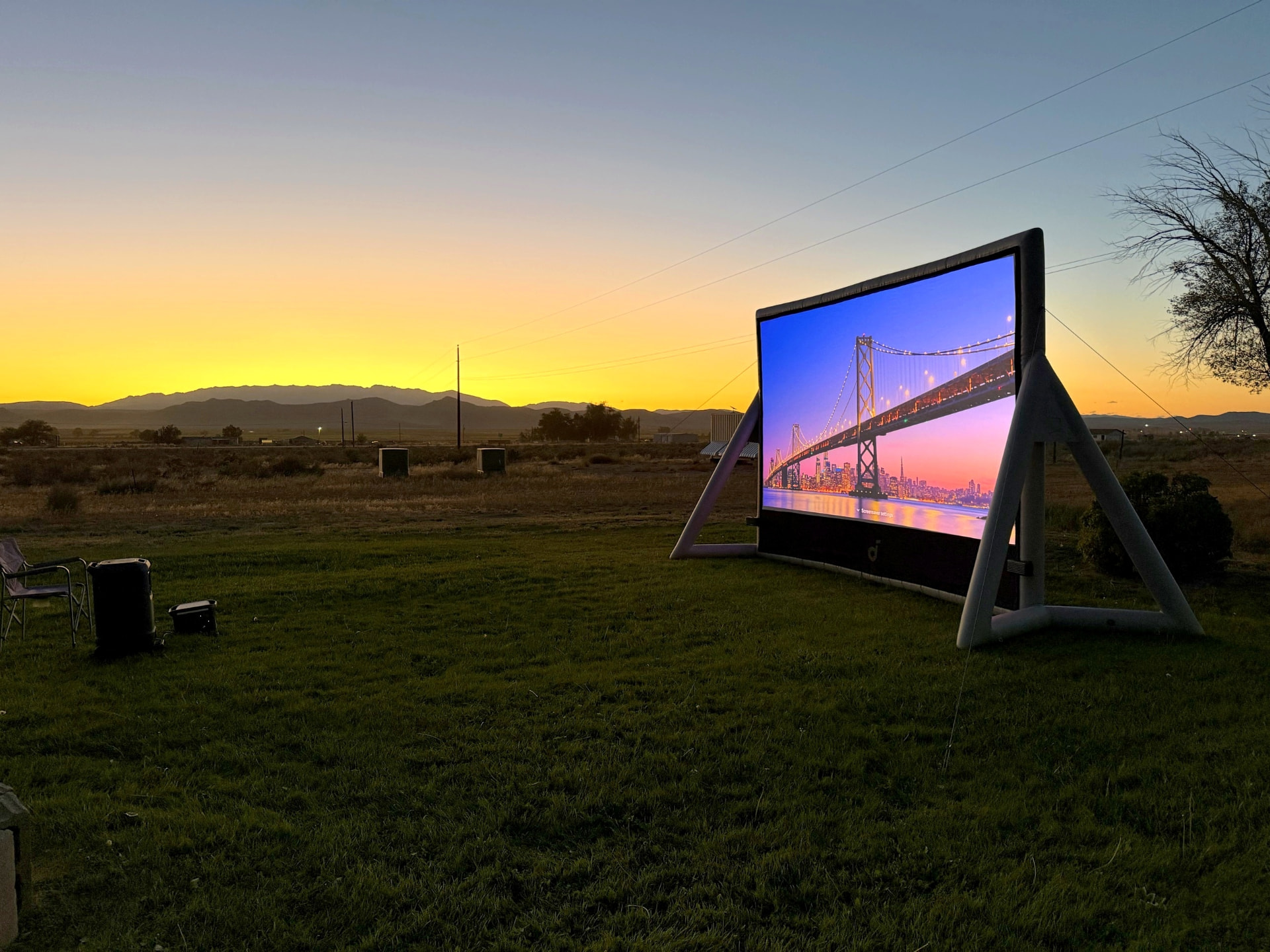 Backyard movie night set up at dusk